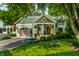 Charming craftsman-style home with swing in front yard and well-manicured lawn at 140 4Th Nw St, Carmel, IN 46032