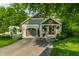 Inviting craftsman home with manicured landscaping, a beautiful lawn, and American flag at 140 4Th Nw St, Carmel, IN 46032