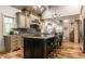 Kitchen with granite countertops, stainless steel appliances, island, and vaulted ceilings at 140 4Th Nw St, Carmel, IN 46032