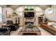 Comfortable living room features a stone fireplace, large windows and hardwood flooring at 140 4Th Nw St, Carmel, IN 46032