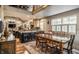 Open-concept living space with gourmet kitchen, dining area, and stone fireplace at 140 4Th Nw St, Carmel, IN 46032