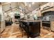 A gourmet kitchen is adjacent to a lovely living area with vaulted ceilings at 140 4Th Nw St, Carmel, IN 46032