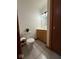 A half bath featuring updated toilet, vanity, and fixtures, offering convenience at 1421 S Meridian St, Indianapolis, IN 46225