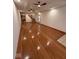 Spacious living room featuring gleaming hardwood floors and recessed lighting at 1421 S Meridian St, Indianapolis, IN 46225