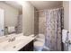 Bathroom featuring a single vanity and a shower-tub combination at 14514 Glapthorn Rd, Fishers, IN 46037