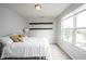 This bedroom features neutral walls, carpet, a double window, and two black floating shelves at 14514 Glapthorn Rd, Fishers, IN 46037