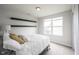 This bedroom features neutral walls, carpet, a double window, and two black floating shelves at 14514 Glapthorn Rd, Fishers, IN 46037