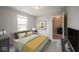 This bedroom features neutral walls, carpet, one window, and an ensuite entrance at 14514 Glapthorn Rd, Fishers, IN 46037
