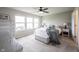 Bright bedroom with three windows, ceiling fan, and neutral décor at 14514 Glapthorn Rd, Fishers, IN 46037