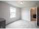 This bedroom features neutral walls, carpet, and an ensuite entrance at 14514 Glapthorn Rd, Fishers, IN 46037