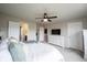 Light filled bedroom with double doors, ceiling fan, and neutral décor at 14514 Glapthorn Rd, Fishers, IN 46037