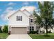 Charming two-story home with a two-car garage and well-manicured lawn at 14514 Glapthorn Rd, Fishers, IN 46037