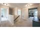 Upstairs hallway offers access to home gym, bedrooms, and natural light at 14514 Glapthorn Rd, Fishers, IN 46037
