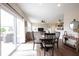 Bright living room with dining area, sliding glass doors to patio, and comfortable furnishings at 14514 Glapthorn Rd, Fishers, IN 46037