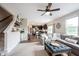 Open-concept living room seamlessly flows into the kitchen, complete with a comfortable sofa and modern finishes at 14514 Glapthorn Rd, Fishers, IN 46037