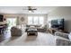 Spacious living room with a large sectional sofa, abundant natural light, and stylish décor at 14514 Glapthorn Rd, Fishers, IN 46037
