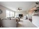 Bright living room features a comfortable sofa, large windows, and a ceiling fan at 14514 Glapthorn Rd, Fishers, IN 46037