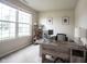 Inviting home office with a large window, modern desk, and neutral color scheme at 14514 Glapthorn Rd, Fishers, IN 46037