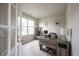 Bright home office featuring a large window, neutral walls, and an updated desk at 14514 Glapthorn Rd, Fishers, IN 46037
