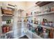 Spacious pantry with extensive shelving for ample storage, perfect for organized living at 14514 Glapthorn Rd, Fishers, IN 46037