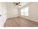 Bright bedroom with hardwood floors, ceiling fan, a double door closet and large window at 1452 Coen Ct, Columbus, IN 47201