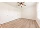 Cozy bedroom with hardwood floors, a ceiling fan, double door closet, and bright window at 1452 Coen Ct, Columbus, IN 47201