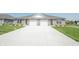 A well-maintained home with a double garage and a long driveway at 1452 Coen Ct, Columbus, IN 47201