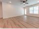 A spacious living room featuring vinyl floors, and a ceiling fan at 1452 Coen Ct, Columbus, IN 47201