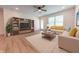 Bright living room with a ceiling fan, and a view of the backyard at 1452 Coen Ct, Columbus, IN 47201