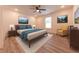 Comfortable bedroom with a ceiling fan, recessed lights and artwork at 1452 Coen Ct, Columbus, IN 47201