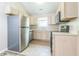 Functional kitchen with stainless steel appliances, light wood cabinetry, and ample counter space at 14911 Silver Thorne Way, Carmel, IN 46033
