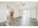 Spacious living room features an open floor plan, high ceilings, neutral paint, and sliding glass doors at 14911 Silver Thorne Way, Carmel, IN 46033