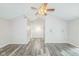 Spacious living room features an open floor plan, high ceilings, neutral paint, and sliding glass doors at 14911 Silver Thorne Way, Carmel, IN 46033
