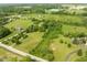 Aerial view of property featuring expansive greenery, mature trees, and country landscape at 15812 Joliet Rd, Westfield, IN 46074