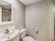 Neutral bathroom featuring a shower with glass doors, vanity, sink, toilet, and tiled ceiling at 15812 Joliet Rd, Westfield, IN 46074