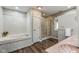 Bathroom with bathtub, shower, and decorative tile, and tile countertop, with ample space at 15812 Joliet Rd, Westfield, IN 46074