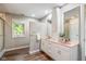 Bathroom with a double vanity and sink, a window, and a separate shower stall at 15812 Joliet Rd, Westfield, IN 46074