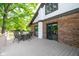 A backyard deck featuring an outdoor dining table with chairs, a view of the yard, and brick exterior at 15812 Joliet Rd, Westfield, IN 46074