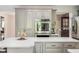 Updated kitchen features white countertops, gray cabinets and modern stainless steel appliances at 15812 Joliet Rd, Westfield, IN 46074