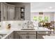 Bright kitchen features a stainless steel sink, white countertops and gray cabinets at 15812 Joliet Rd, Westfield, IN 46074