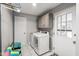 Functional laundry room with appliances and ample storage space, featuring clean, white tones at 15812 Joliet Rd, Westfield, IN 46074