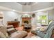 Cozy living room featuring wood floors, a brick fireplace and comfortable seating at 15812 Joliet Rd, Westfield, IN 46074