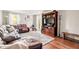Comfortable living room featuring a large sectional sofa, entertainment center, and natural light from the window at 15812 Joliet Rd, Westfield, IN 46074