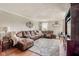 Inviting living room with plush seating, soft rug, and elegant decor, perfect for relaxing and entertaining at 15812 Joliet Rd, Westfield, IN 46074