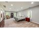 Spacious main bedroom with neutral carpet, natural light, and comfortable seating area, creating a relaxing retreat at 15812 Joliet Rd, Westfield, IN 46074