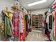 Walk-in closet with custom shelving and ample storage for clothing and accessories, with carpet at 15812 Joliet Rd, Westfield, IN 46074