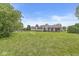 Large, flat backyard ideal for outdoor activities and entertaining friends at 1631 Wilford Ln, Indianapolis, IN 46229