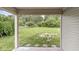 Secluded view of the home's serene backyard and beautiful trees at 1631 Wilford Ln, Indianapolis, IN 46229