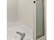 This bathroom includes a shower with glass doors and a relaxing soaking tub at 1631 Wilford Ln, Indianapolis, IN 46229