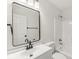 Bathroom featuring white cabinetry, modern fixtures, and a shower-tub combo at 1631 Wilford Ln, Indianapolis, IN 46229